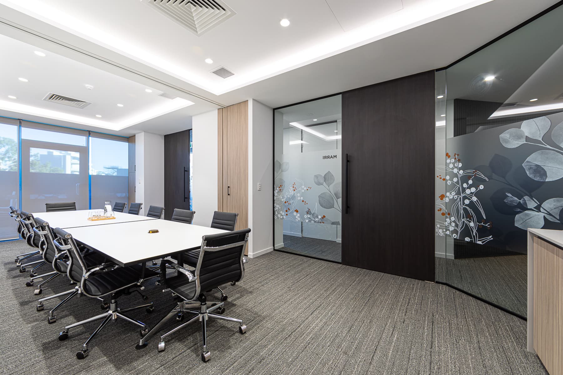 Meeting room with frosted glass and hidden LED lighting.