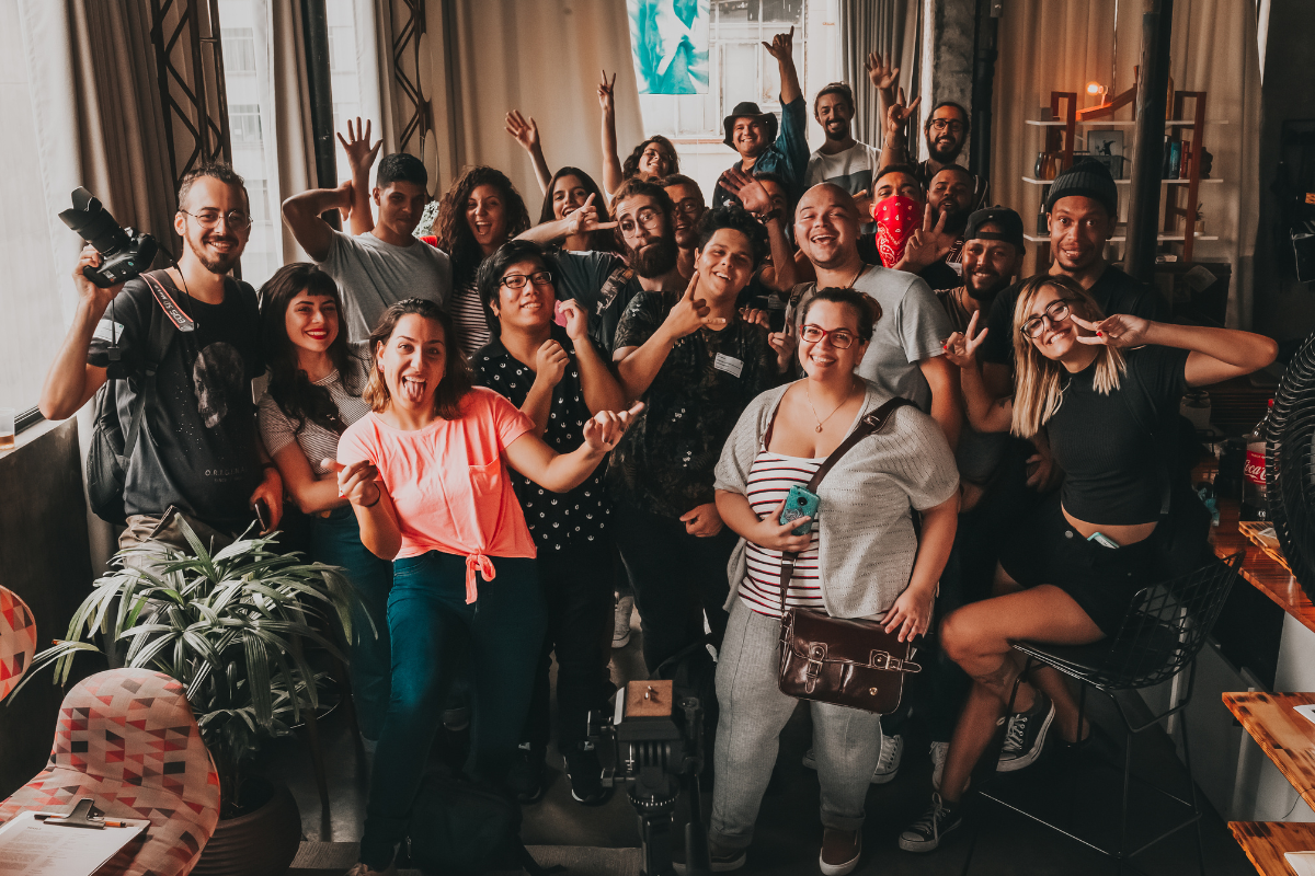 a group of workers embracing a positive workplace culture