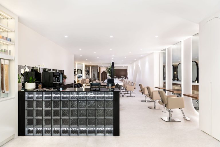 Beauty salon fitout in West Perth with glass block reception desk and styling stations